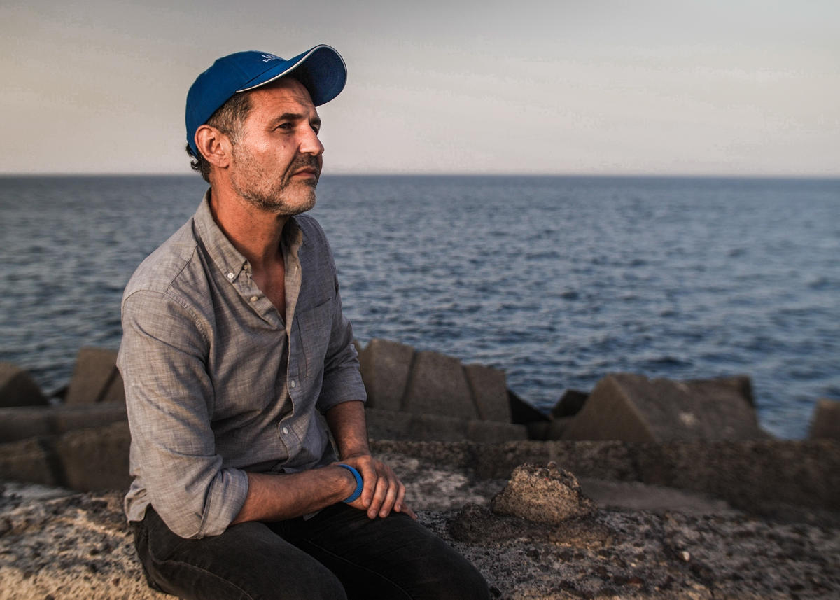 Italy. UNHCR Goodwill Ambassador Khaled Hosseini meets refugees who have survived the perilous sea crossing to Europe