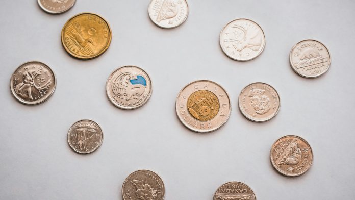 PiggyBank via Unsplash PiggyBank via Unsplash unsplash.com/photos/a-bunch-of-different-types-of-coins-on-a-table-8Wwft7EYzFg)